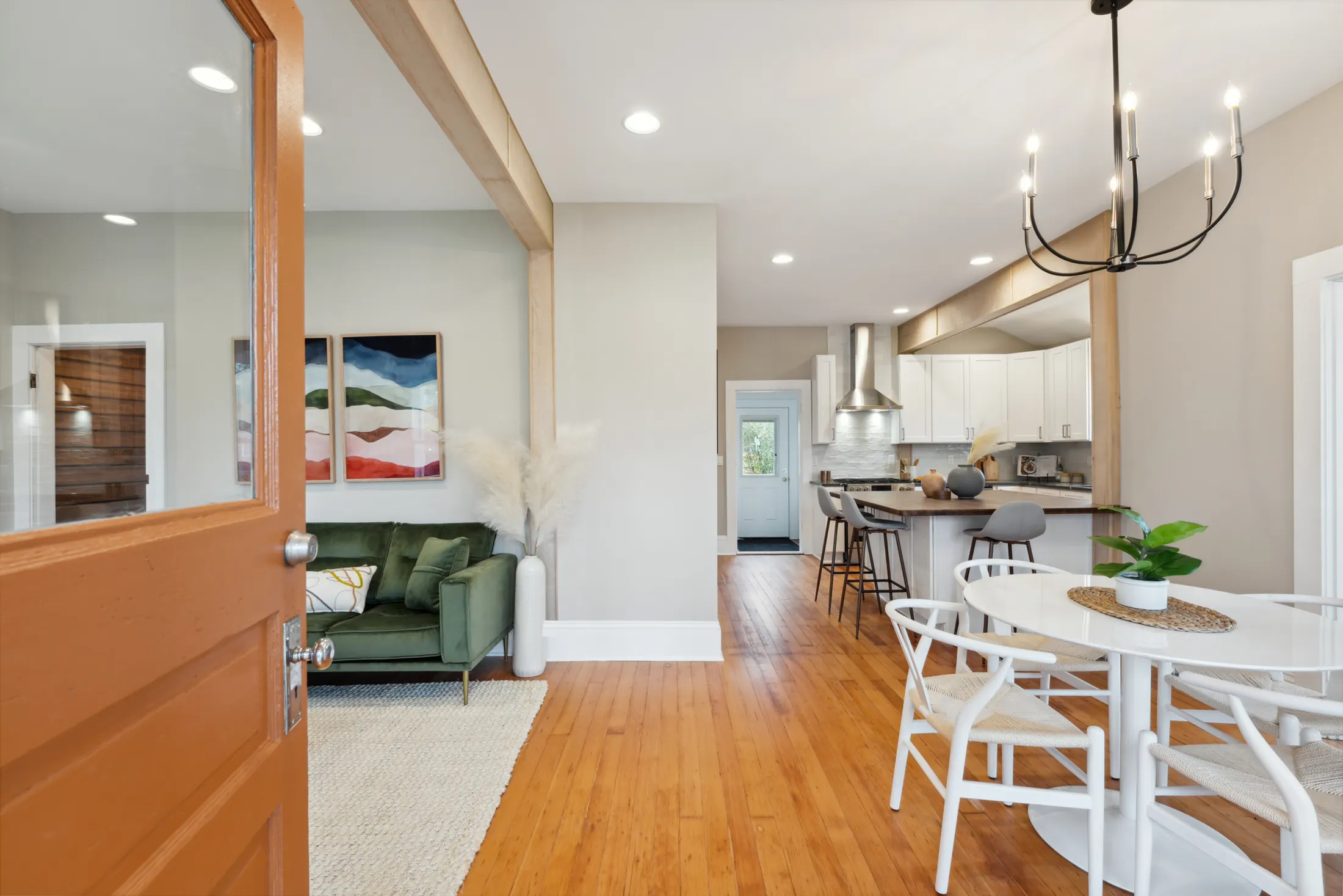Open-concept kitchen and living room after the H Street whole-home remodel